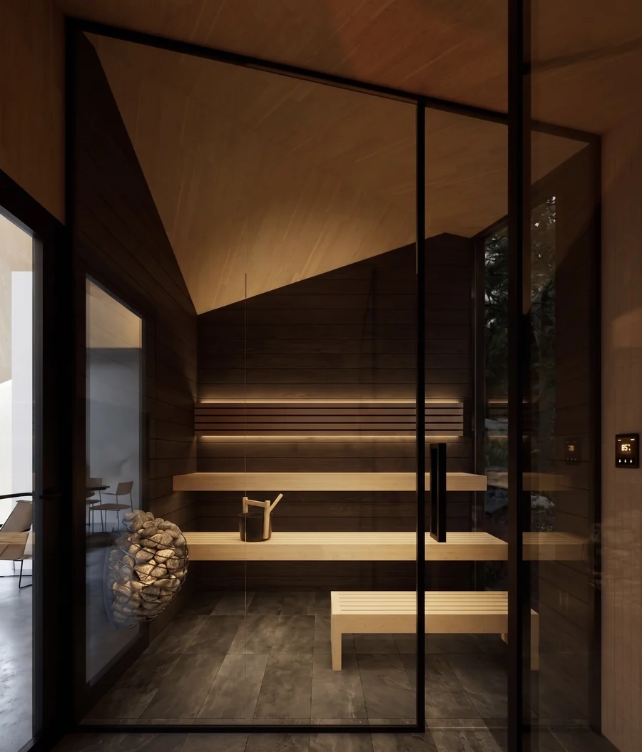 Dark timber sauna room behind glass with softly illuminated benches